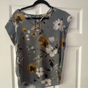 Size large. Grey background with floral design.